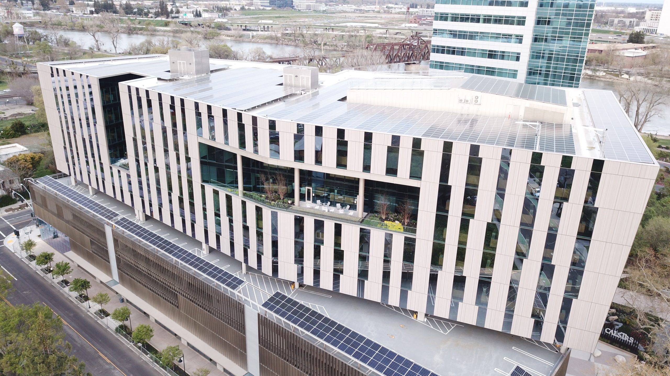 Arial side view of the CalSTRS Tower open air with four large balcony patio areas.